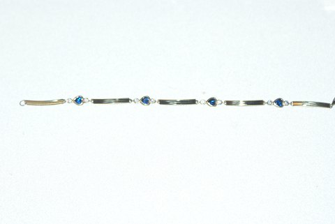 Elegant armbånd med blå safir i 14 karat guld
