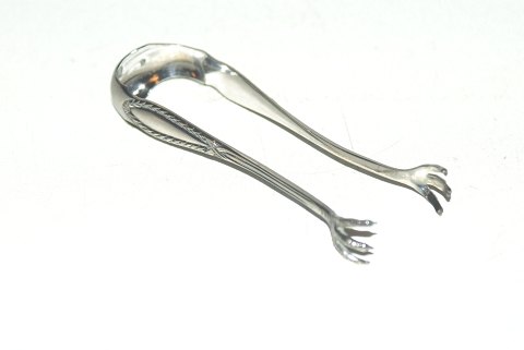 Sugar pliers in silver
Length 11.5 cm.
Produced in the year 1908