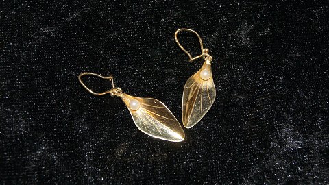 Øreringe med stikker og 14 karat guld og perle
Stemplet 585