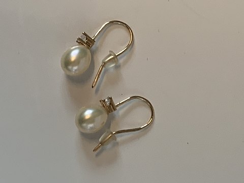 Øreringe med perle 14 karat Guld
Stemplet 585