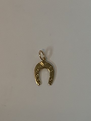 Horse shoe in 14 karat gold
Stamped 585
Height 15.91 mm