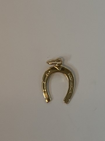 Horse shoe in 14 karat gold
Stamped EH 585
Height 19.87 mm