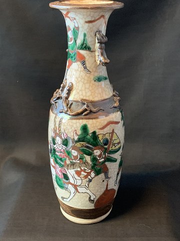 Tall slim Chinese vase in classic style, with many details.