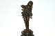 Boy with accordion made of patinated bronze