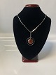 Silver necklace with Amber pendant
Stamped N.E. From 925S, length 46 cm.