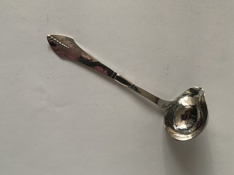 B 3. Silver cream spoon
Hansen & Andersen.
Length approx. 14 cm.