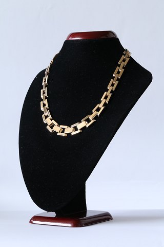 Block gold necklace in 14 carat gold with 3 rows in sequence, and box lock. 
Stamped GIFA 585.
SOLD