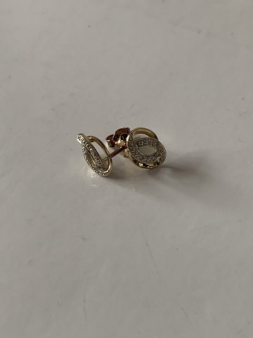 Earrings in 14 carat white and red gold with embedded brilliants.