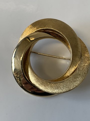 14 Karat gold brooch
Diameter 3.6 cm.