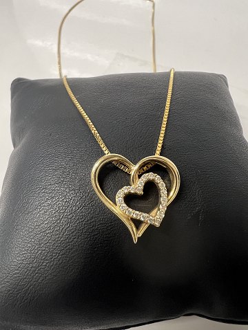 14 kt Heart pendant with inlaid diamonds and Necklace.Length 51.8 cm