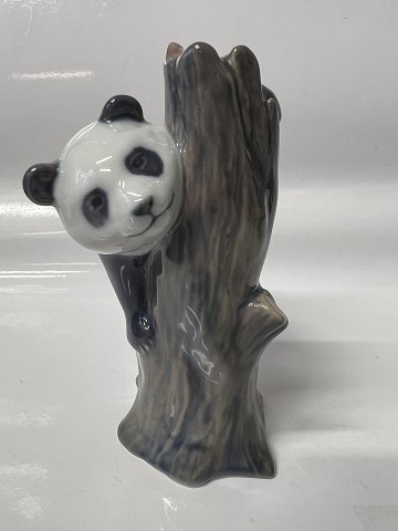 Royal Copenhagen figurine, Panda on a tree stump. Height 13 cm. No. 664.