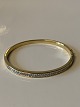 Armring 18 karat Guld med brillianter
Stemplet 750
Længde   59,66 mm ca
Højde 4,13 mm ca