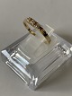 Gold ring in 14 carats, stamped 585, size 56. m. 3 clear stones.