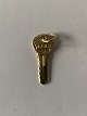 Charm for bracelet in 14 carat gold, stamped 585. Shaped like a key.