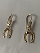 Smukke øreringe Hestesko14 karat guld, stilet design.