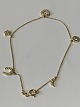 Gold bracelet in 14 carat gold, with beautiful pendants. Stamped 585.