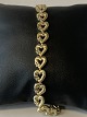 Gold bracelet in 14 carat gold, with diamonds. Unique design and stamped 585.