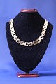 Block necklace with 3 rows and no progression.
Stamped Jø.S 585