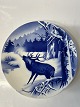 Red deer among trees in winter.Ø 20.5 cm