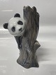 Royal Copenhagen figurine, Panda on a tree stump. Height 13 cm. No. 664.